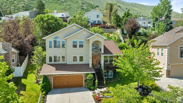 468 E Brewster, Draper, UT 84020 - view of front of property featuring a garage, stairway, driveway, and a mountain view