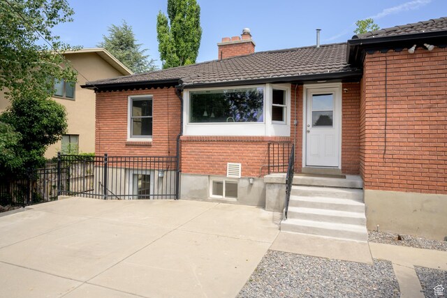 2366 E Logan Way, Salt Lake City, UT 84108 - back of property with a chimney and brick siding