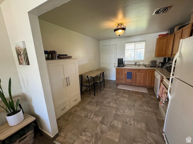 237 W 310 N, Orem, UT 84057 - kitchen featuring white appliances, a sink, brown cabinets, and light countertops