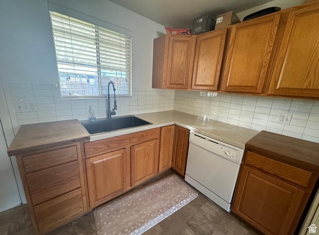 237 W 310 N, Orem, UT 84057 - kitchen featuring white dishwasher, a sink, brown cabinets, tasteful backsplash, and light countertops