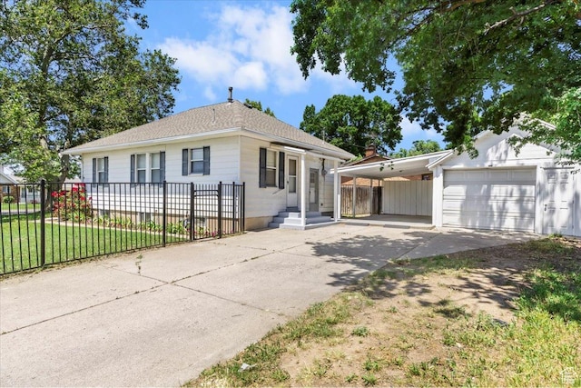 106 N 400 E, Kaysville, UT 84037 - view of front facade with driveway, a garage, an attached carport, and a shingled roof