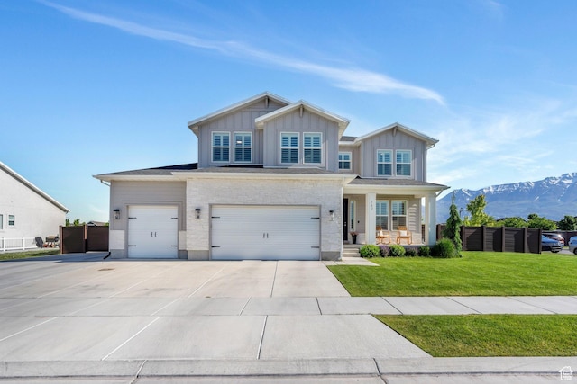 162 W 350 N, Vineyard, UT 84059 - craftsman house featuring driveway, a porch, board and batten siding, a mountain view, and an attached garage