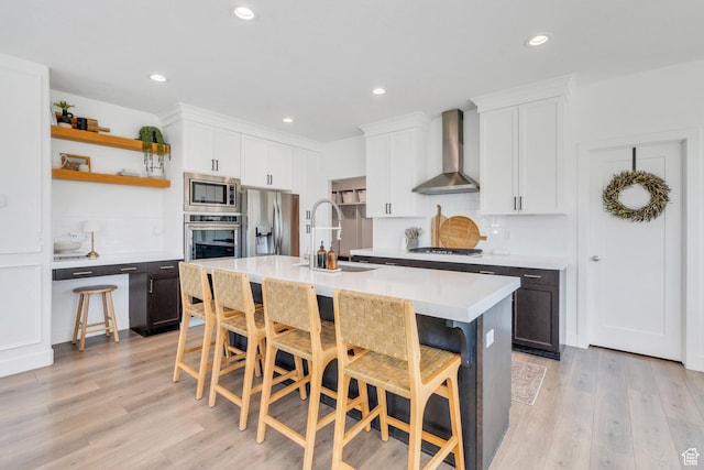 162 W 350 N, Vineyard, UT 84059 - kitchen with stainless steel appliances, wall chimney exhaust hood, a sink, backsplash, and light countertops