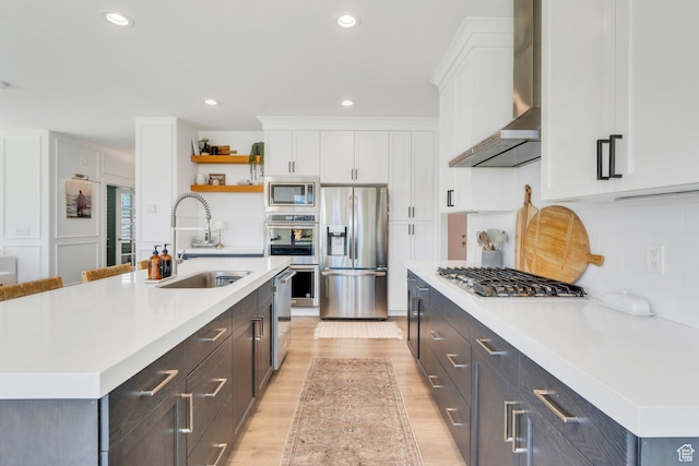 162 W 350 N, Vineyard, UT 84059 - kitchen with appliances with stainless steel finishes, wall chimney exhaust hood, a sink, white cabinetry, and light countertops