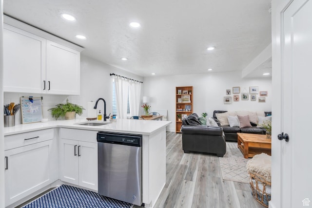 162 W 350 N, Vineyard, UT 84059 - kitchen featuring stainless steel dishwasher, a sink, a peninsula, white cabinets, and light wood-style flooring