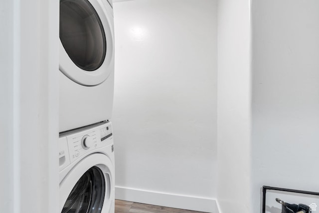 162 W 350 N, Vineyard, UT 84059 - washroom with stacked washer and clothes dryer, baseboards, and wood finished floors