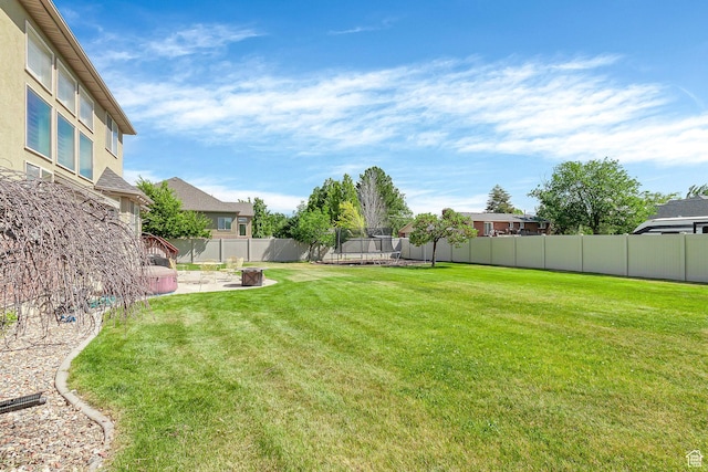 2733 S 1415 W, Syracuse, UT 84075 - view of yard with a trampoline and a patio area