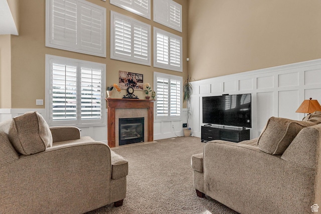 2733 S 1415 W, Syracuse, UT 84075 - carpeted living area featuring a fireplace and a towering ceiling