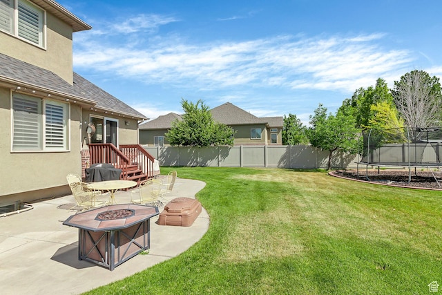 2733 S 1415 W, Syracuse, UT 84075 - view of yard featuring a patio area, a trampoline, and a fire pit