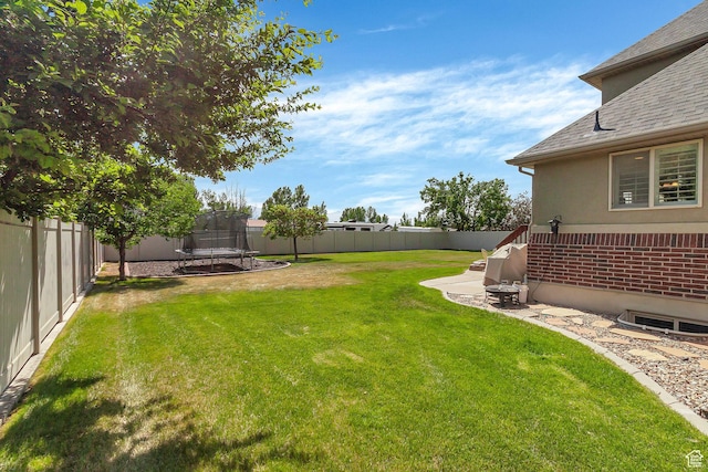 2733 S 1415 W, Syracuse, UT 84075 - view of yard with a trampoline and a patio area