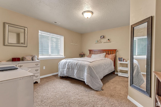 2733 S 1415 W, Syracuse, UT 84075 - bedroom with multiple windows, light carpet, a textured ceiling, and baseboards