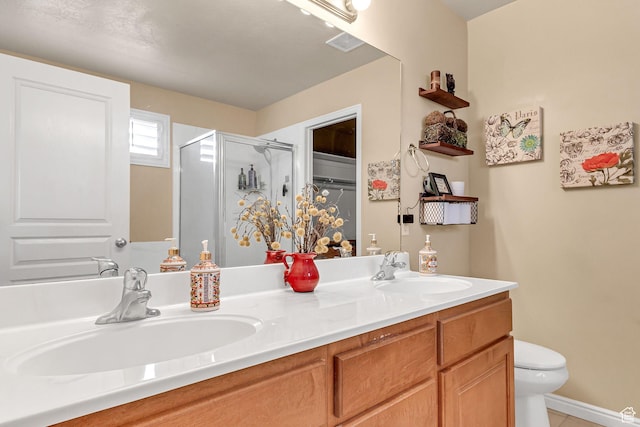 2733 S 1415 W, Syracuse, UT 84075 - bathroom featuring a shower stall, double vanity, toilet, and tile patterned floors