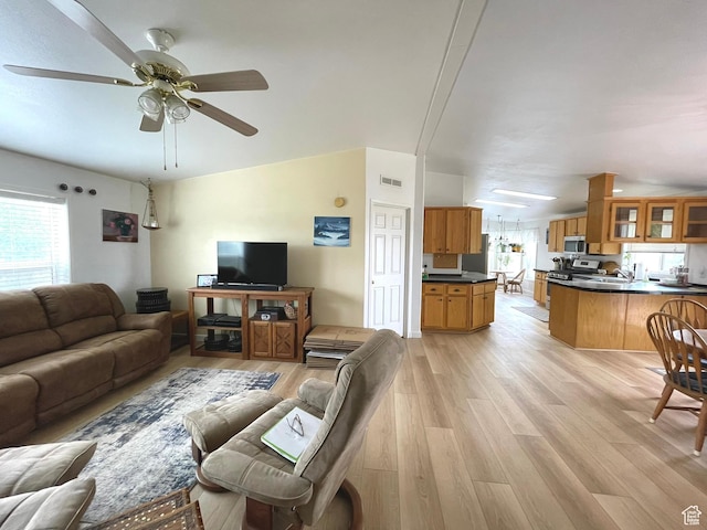 870 S 100 E, Wellington, UT 84542 - living area featuring light wood finished floors and ceiling fan