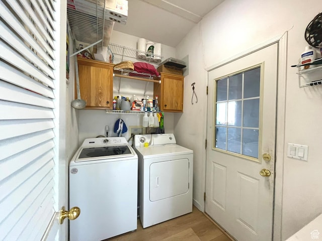 870 S 100 E, Wellington, UT 84542 - laundry room featuring cabinet space, washing machine and clothes dryer, and light wood-type flooring
