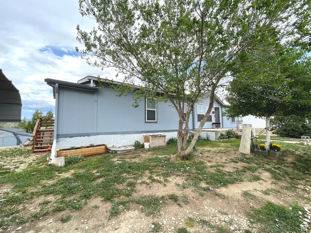870 S 100 E, Wellington, UT 84542 - view of side of home featuring stairway