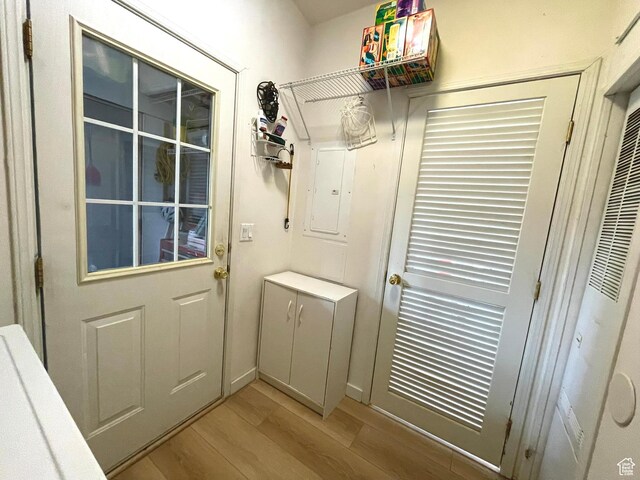 870 S 100 E, Wellington, UT 84542 - doorway to outside featuring light wood-style floors and a heating unit