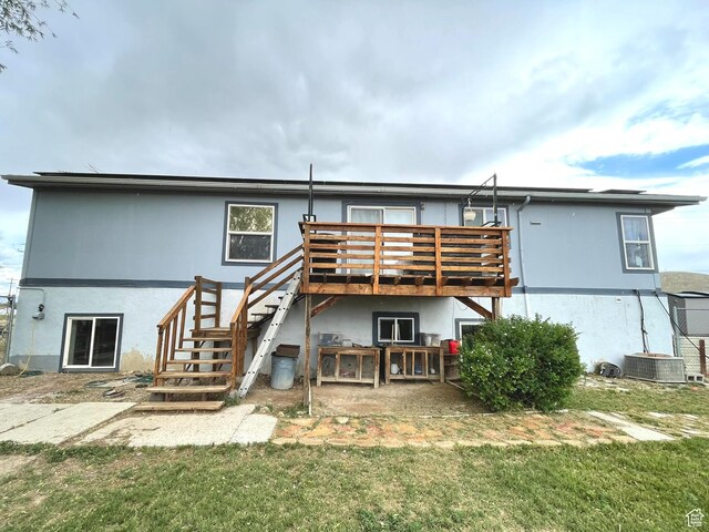 870 S 100 E, Wellington, UT 84542 - back of house featuring a deck, stucco siding, stairway, and central AC