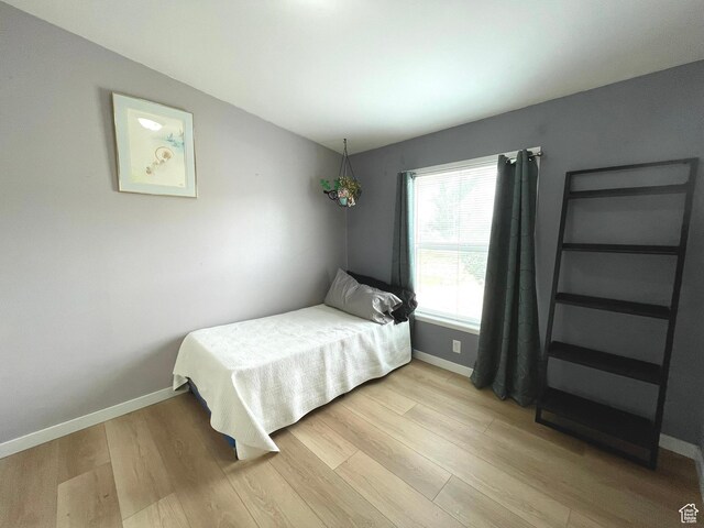 870 S 100 E, Wellington, UT 84542 - bedroom featuring light wood-style flooring and baseboards