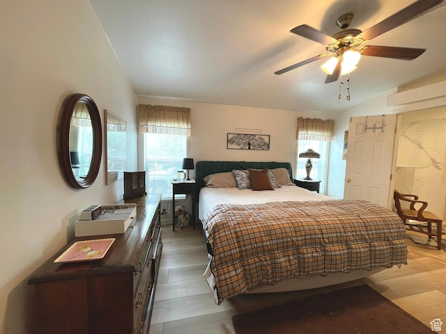 870 S 100 E, Wellington, UT 84542 - bedroom featuring a ceiling fan, light wood-style floors, and lofted ceiling