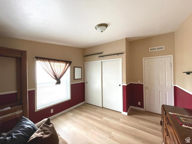 870 S 100 E, Wellington, UT 84542 - bedroom featuring light wood-style flooring, baseboards, and a closet
