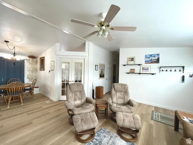 870 S 100 E, Wellington, UT 84542 - living room featuring ceiling fan, light wood-style floors, a chandelier, and baseboards