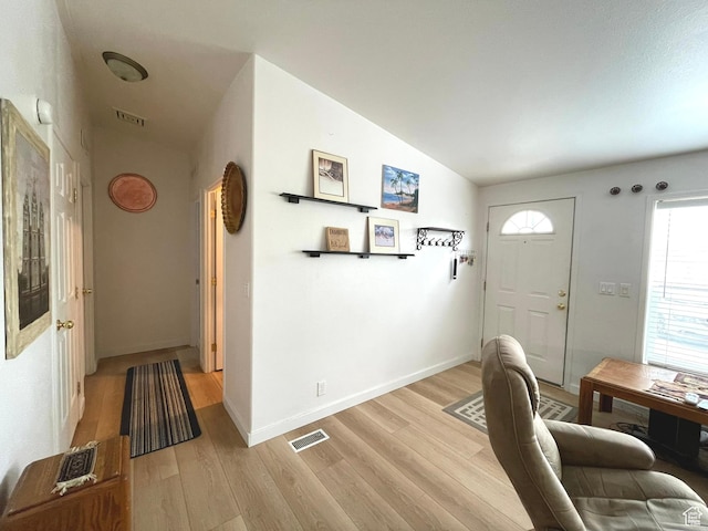 870 S 100 E, Wellington, UT 84542 - entryway featuring lofted ceiling, light wood-type flooring, and baseboards