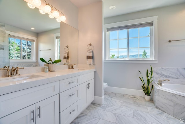 500 W Cascade Pkwy, Midway, UT 84049 - bathroom with double vanity, a garden tub, toilet, baseboards, and marble look tile flooring