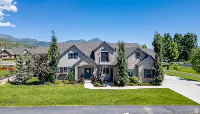 500 W Cascade Pkwy, Midway, UT 84049 - french country style house featuring stone siding, a front lawn, driveway, and a mountain view
