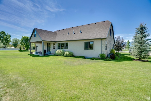 500 W Cascade Pkwy, Midway, UT 84049 - back of house with a lawn and a shingled roof