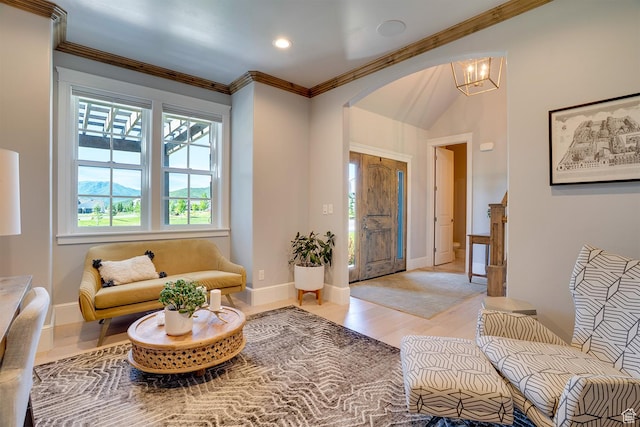 500 W Cascade Pkwy, Midway, UT 84049 - living room featuring arched walkways, baseboards, ornamental molding, light wood-type flooring, and a chandelier