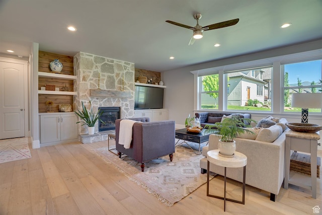 500 W Cascade Pkwy, Midway, UT 84049 - living room with light wood-type flooring, a ceiling fan, recessed lighting, and a stone fireplace