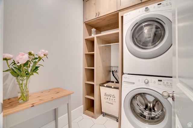 500 W Cascade Pkwy, Midway, UT 84049 - laundry area with stacked washing machine and dryer, cabinet space, and light tile patterned flooring