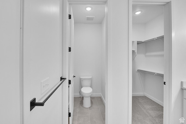 1162 N 375th St W Unit 22, Harrisville, UT 84404 - bathroom with toilet, a spacious closet, recessed lighting, baseboards, and tile patterned flooring
