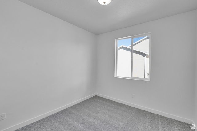 1162 N 375th St W Unit 22, Harrisville, UT 84404 - spare room featuring baseboards and carpet floors