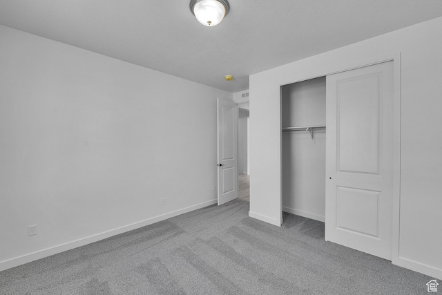 1162 N 375th St W Unit 22, Harrisville, UT 84404 - unfurnished bedroom featuring carpet flooring, a closet, and baseboards
