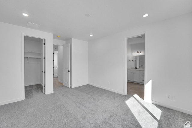 1162 N 375th St W Unit 22, Harrisville, UT 84404 - unfurnished bedroom with carpet flooring, recessed lighting, a walk in closet, and baseboards