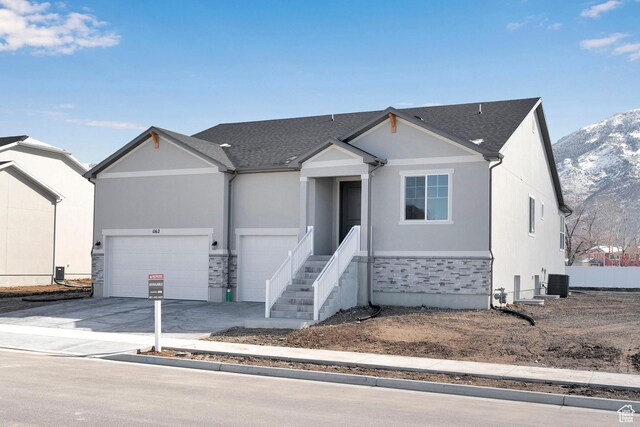 1162 N 375th St W Unit 22, Harrisville, UT 84404 - ranch-style house featuring stone siding, a mountain view, driveway, and an attached garage