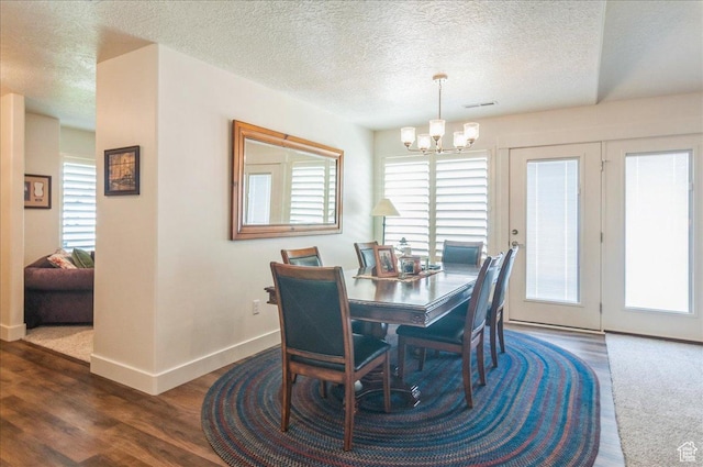 1123 S 4150 W, West Point, UT 84015 - dining space with a chandelier, a textured ceiling, baseboards, and wood finished floors