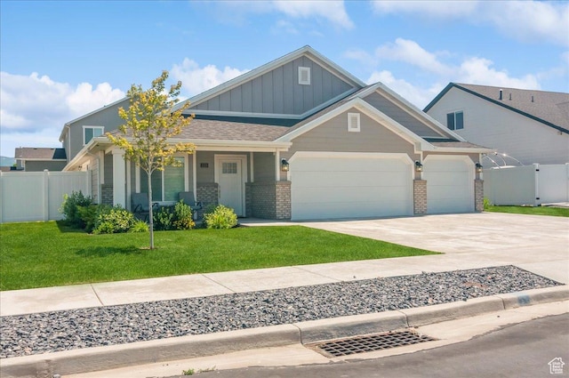 1123 S 4150 W, West Point, UT 84015 - craftsman house featuring board and batten siding, a garage, driveway, brick siding, and covered porch