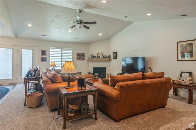 1123 S 4150 W, West Point, UT 84015 - living room with vaulted ceiling, light colored carpet, ceiling fan, a fireplace, and recessed lighting