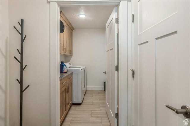1123 S 4150 W, West Point, UT 84015 - washroom with cabinet space, washer and clothes dryer, baseboards, and a textured ceiling