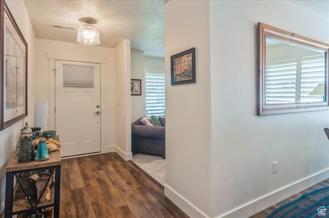 1123 S 4150 W, West Point, UT 84015 - entrance foyer with a textured ceiling, baseboards, and wood finished floors