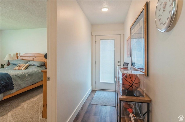 1123 S 4150 W, West Point, UT 84015 - doorway to outside with baseboards, wood finished floors, and a textured ceiling