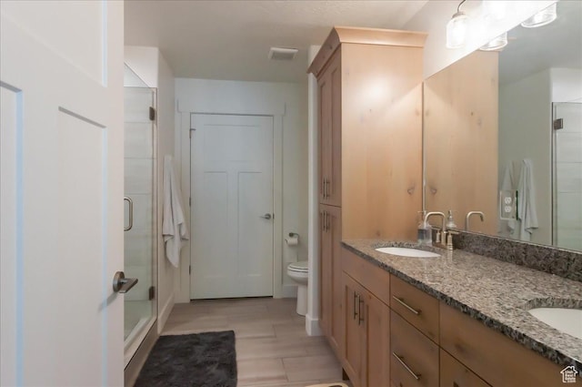 1123 S 4150 W, West Point, UT 84015 - full bathroom with double vanity, toilet, a shower stall, and wood finished floors