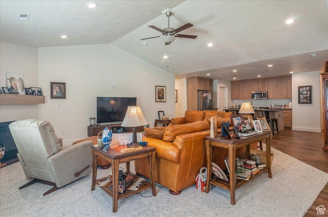 1123 S 4150 W, West Point, UT 84015 - living area with a ceiling fan, vaulted ceiling, recessed lighting, wood finished floors, and a textured ceiling