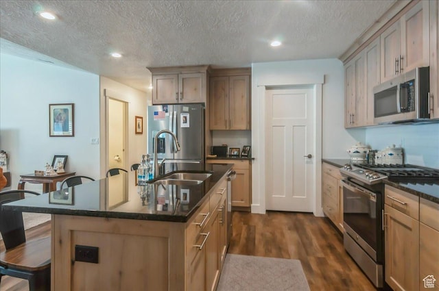 1123 S 4150 W, West Point, UT 84015 - kitchen with stainless steel appliances, a sink, a kitchen bar, a textured ceiling, and dark wood-type flooring
