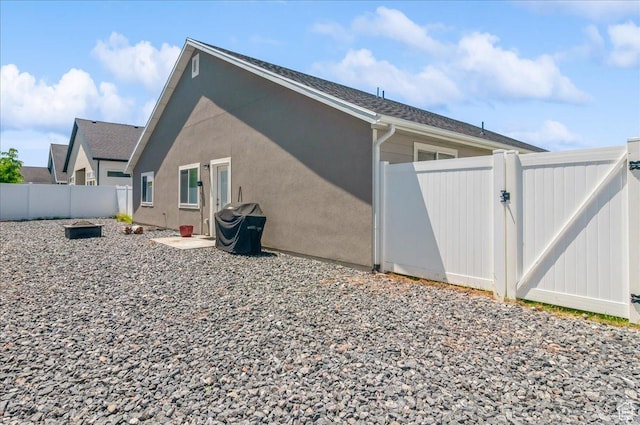 1123 S 4150 W, West Point, UT 84015 - view of home's exterior featuring a gate and a fenced backyard