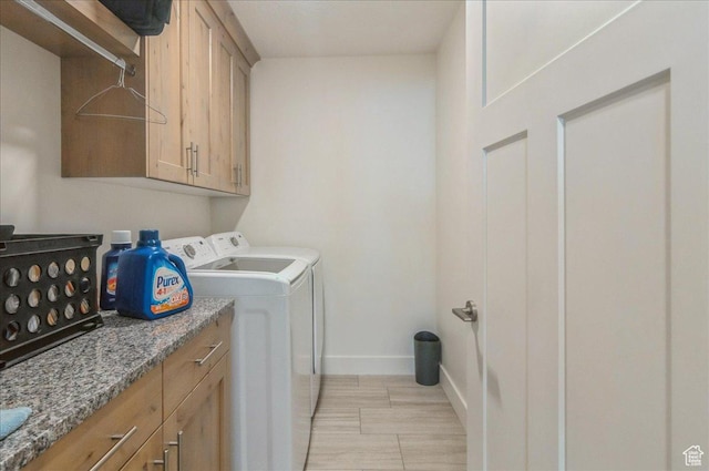 1123 S 4150 W, West Point, UT 84015 - laundry area with separate washer and dryer, baseboards, cabinet space, and light wood-style flooring