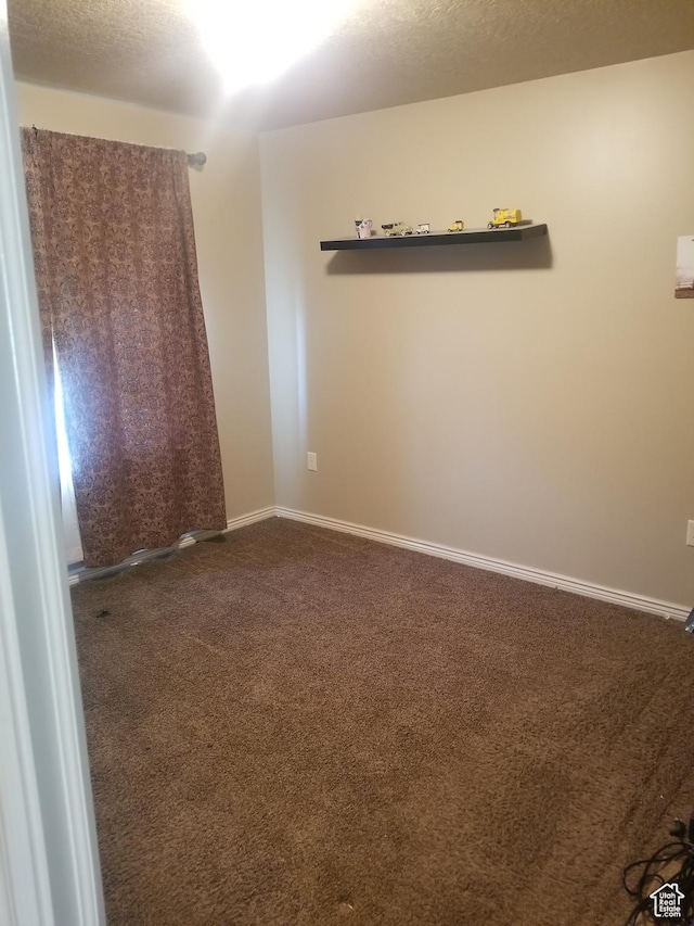4895 W 5000 S, Hooper, UT 84315 - unfurnished room with dark colored carpet and baseboards