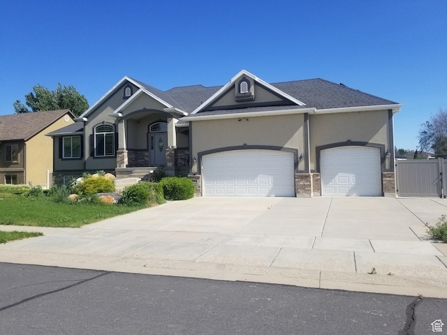 4895 W 5000 S, Hooper, UT 84315 - craftsman house with stucco siding, driveway, an attached garage, and stone siding